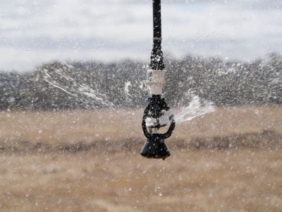Farm sprinkler watering crops