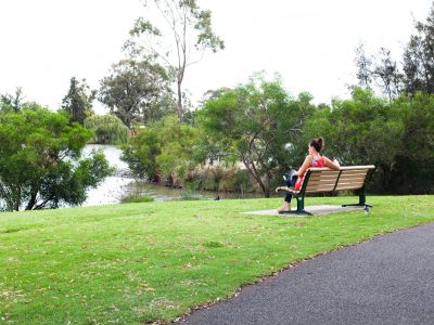 Woman in green park.